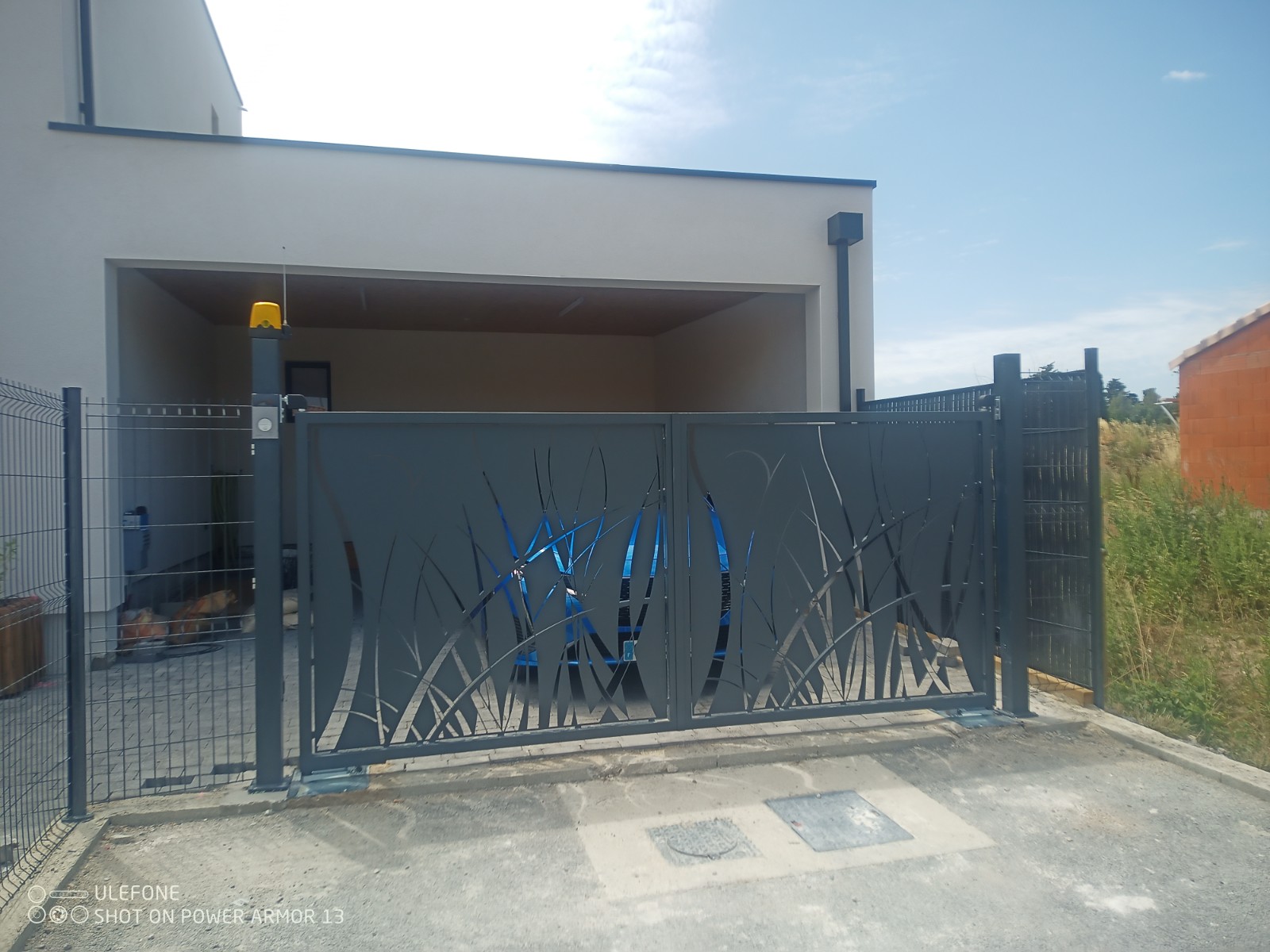 Installation portail acier